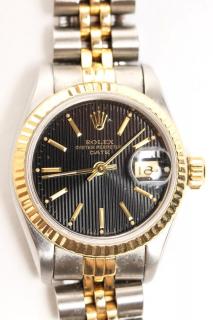 Appraisal: Woman's K Gold Steel Rolex Oyster Watch With black face