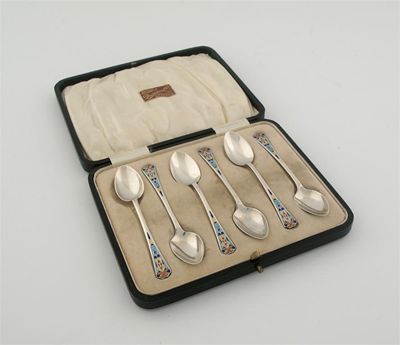 Appraisal: A cased set of six modern coffee spoons with enamelled