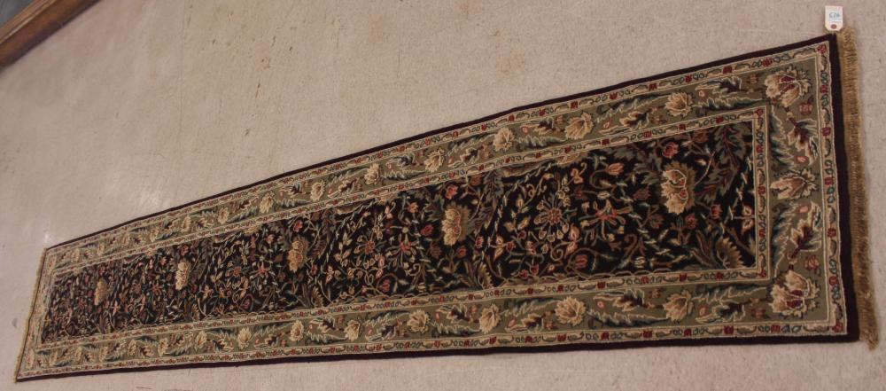 Appraisal: FINE HAND KNOTTED ORIENTAL RUNNER Indo-Persian floral design on burgundy