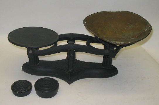 Appraisal: AN AMERICAN IRON GROCERY BALANCE SCALES having a copper pan