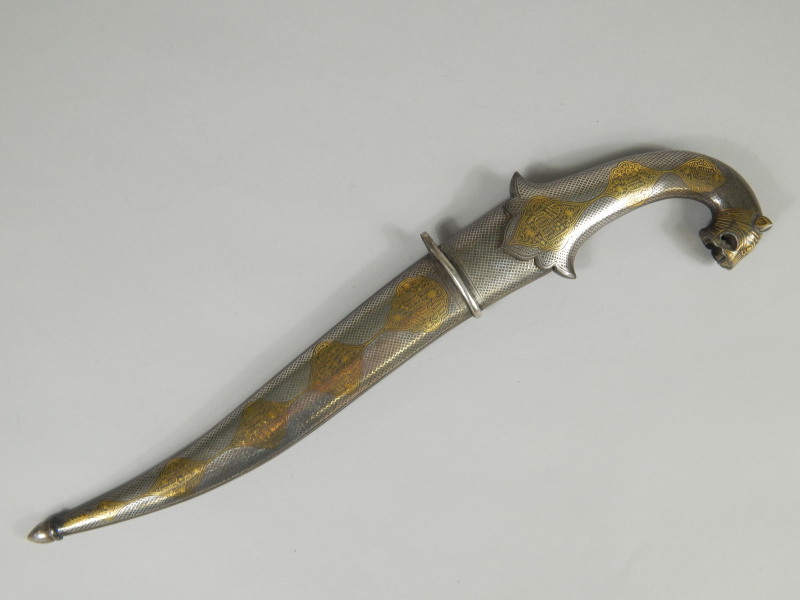 Appraisal: An Eastern dagger with shaped damascened blade centrally engraved the