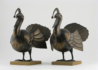 Appraisal: A pair of Middle Eastern iron models of turkeys decorated