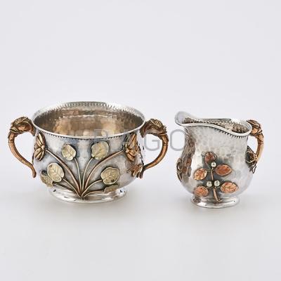 Appraisal: JAPANESQUE STERLING MIXED METAL SUGAR AND CREAMER Gorham bulbous open