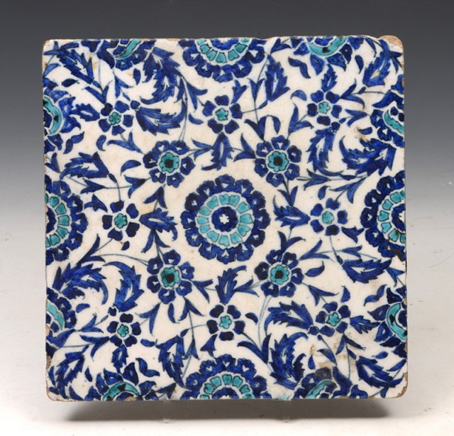 Appraisal: AN ISNIK SQUARE POTTERY TILE with blue and turquoise flower