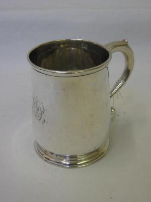 Appraisal: A GEORGE II TANKARD of tapering form with moulded rim