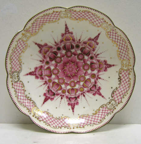 Appraisal: AUSTRIAN ENAMEL BOWL Round scalloped painted magenta enamel floral rosette