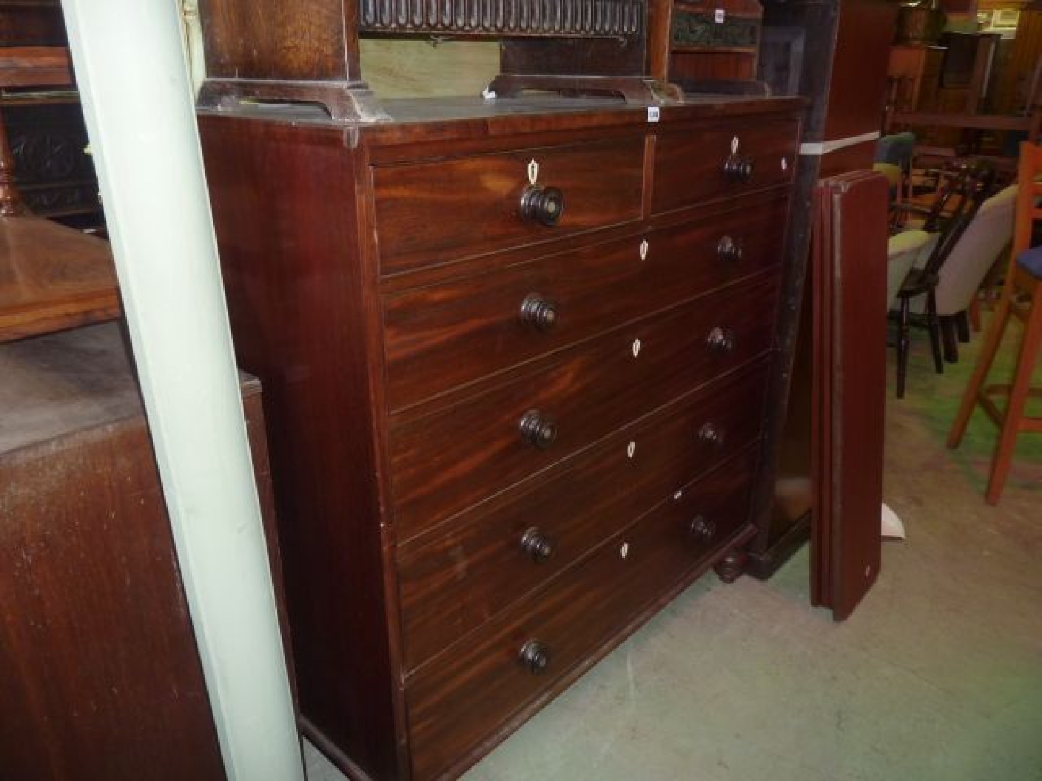 Appraisal: A substantial mid Victorian mahogany chest of four long and