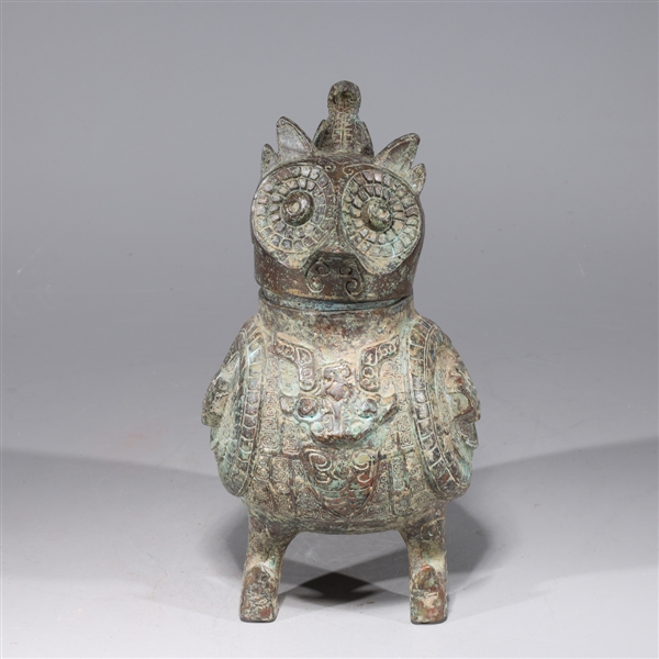 Appraisal: Chinese archaistic bronze owl vessel with intricate designs and bird