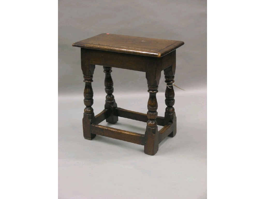 Appraisal: A good quality solid dark oak joint stool on baluster