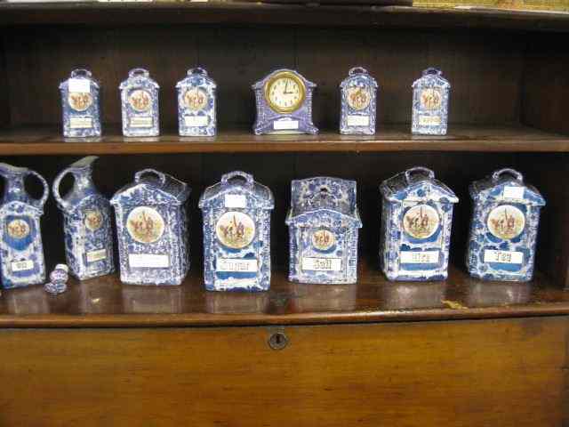 Appraisal: pc German Lusterware Porcelaincannister set with clock oil vinegar bottles