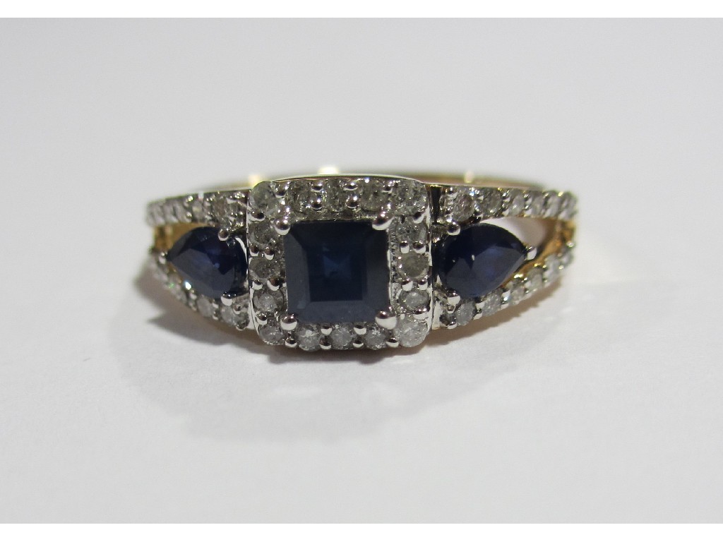 Appraisal: Nine carat gold sapphire and diamond set dress ring with