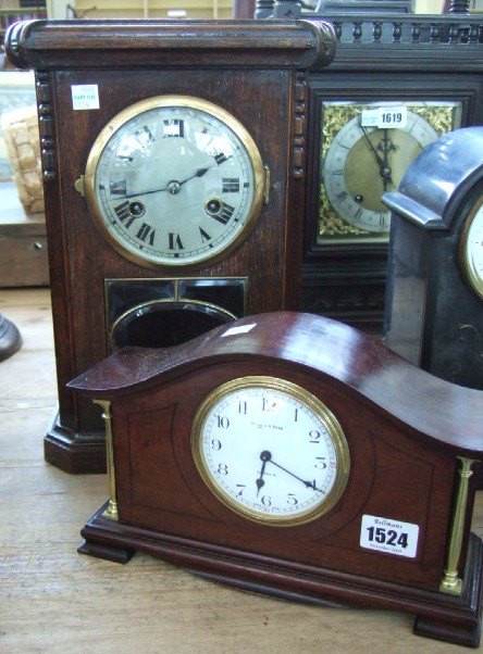 Appraisal: A mahogany cased eight day mantel clock with white enamel