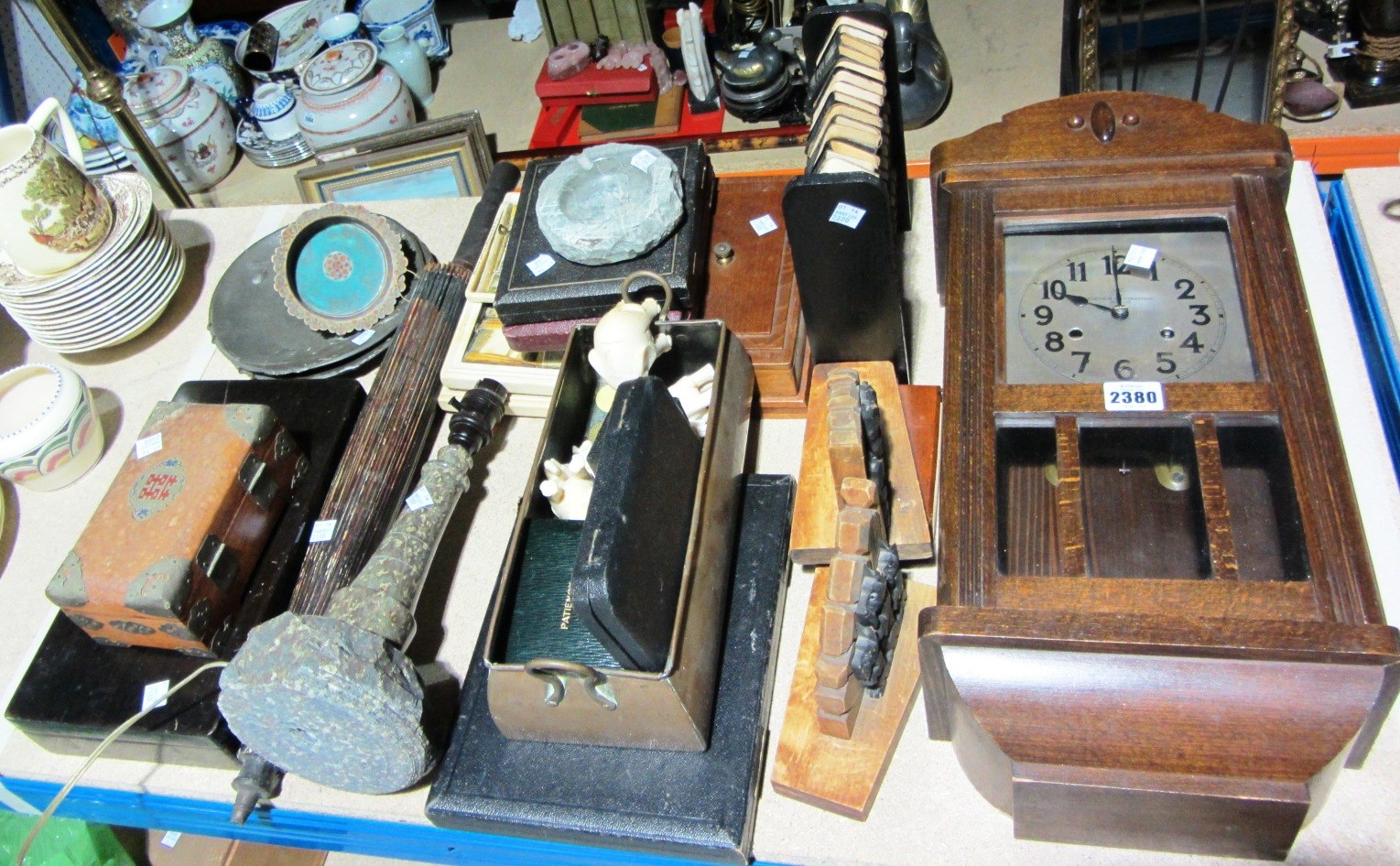 Appraisal: A quantity of collectables including an oak wall clock plated