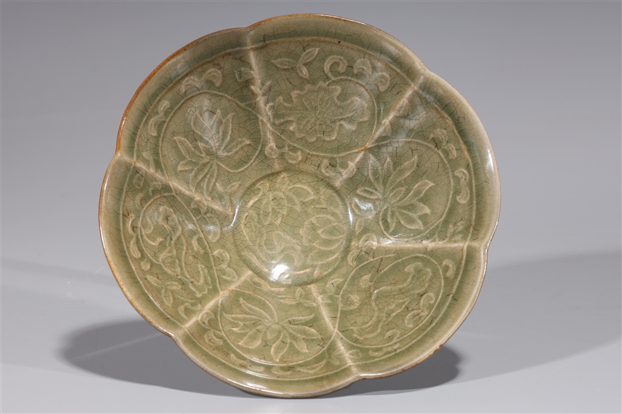 Appraisal: Chinese celadon glazed Yuan style dish with floral designs to