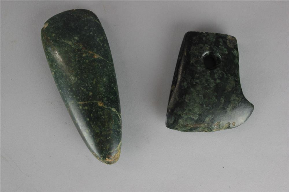 Appraisal: TWO PRIMITIVE STYLE STONE TOOLS both of a dark green