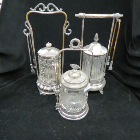 Appraisal: Victorian Pickle Castors pattern glass inserts in silverplate holders with