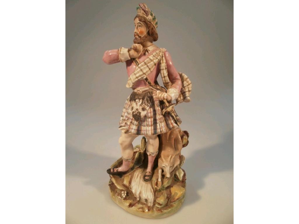 Appraisal: A thC Staffordshire porcelaineous figure group of a highlander with