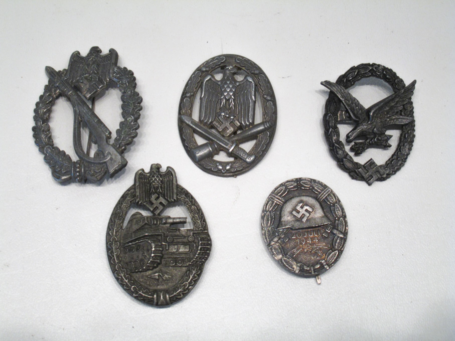 Appraisal: FIVE WORLD WAR TWO STYLE GERMAN BADGES including Juli wound