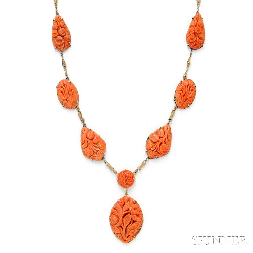 Appraisal: Carved Coral Necklace set with coral panels carved and pierced