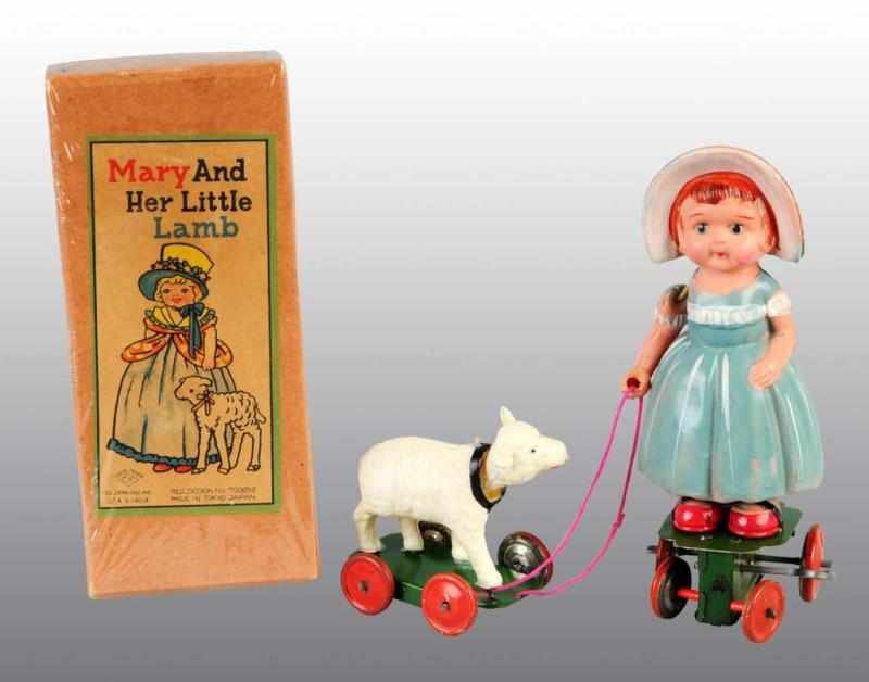 Appraisal: Celluloid Mary Her Little Lamb Wind-Up Toy Description Japanese Pre-war