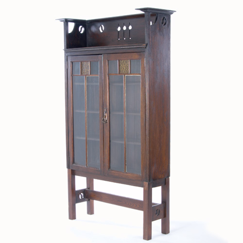 Appraisal: ENGLISH ARTS CRAFTS Two-door bookcase with a tall gallery cut-out