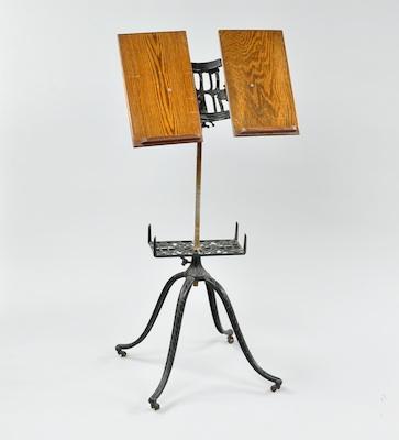 Appraisal: A Victorian Metal and Oak Book Stand With two adjustable