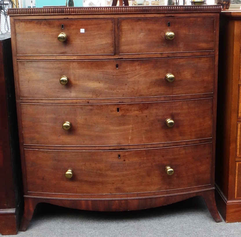 Appraisal: A mid th century mahogany bowfront chest with two short