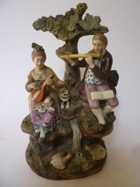 Appraisal: A PEARLWARE FIGURE GROUP early th century Rural Past-Times modelled