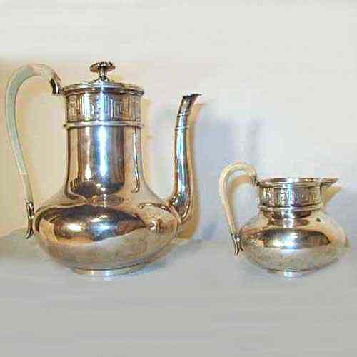 Appraisal: A Dutch Silver Coffee Pot and Creamer circa the coffee