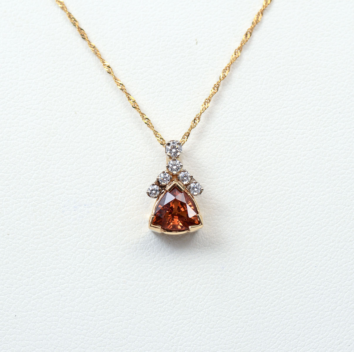 Appraisal: K SPINEL AND DIAMOND PENDANT K yellow gold pendant contains