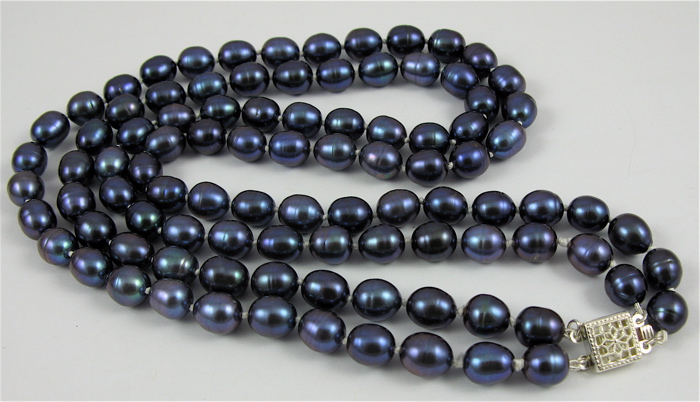 Appraisal: DOUBLE STRANDED BLUE FRESHWATER PEARL NECKLACE strung with oval violet-blue