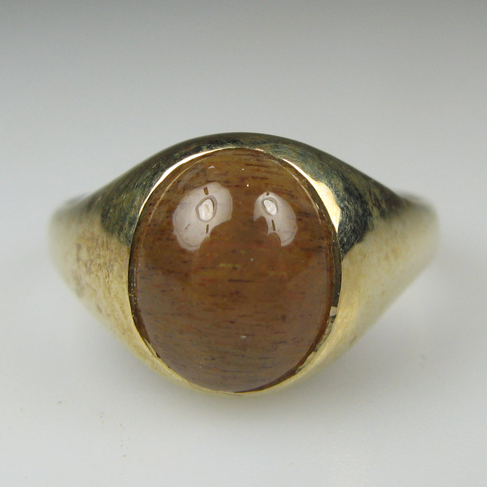 Appraisal: English k Yellow Gold Ring bezel set with an oval