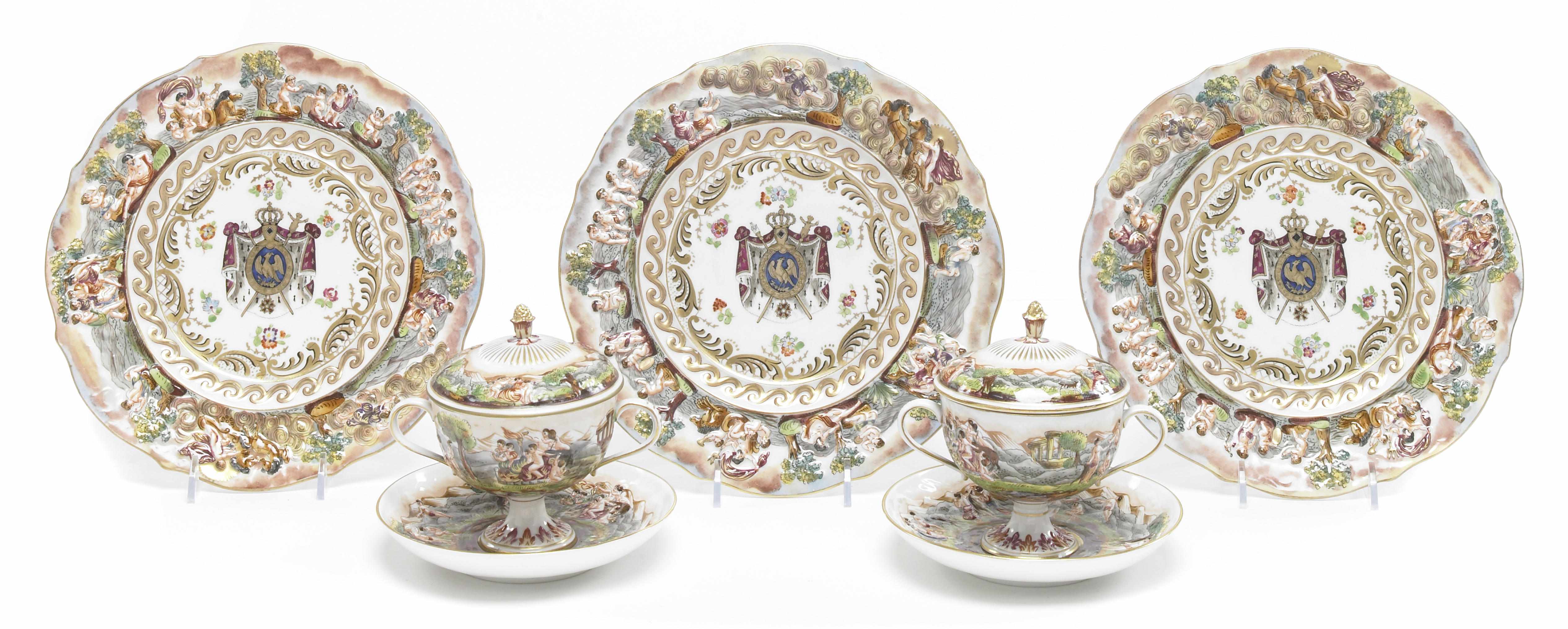 Appraisal: A Capodimonte style armorial porcelain part dessert service second quarter