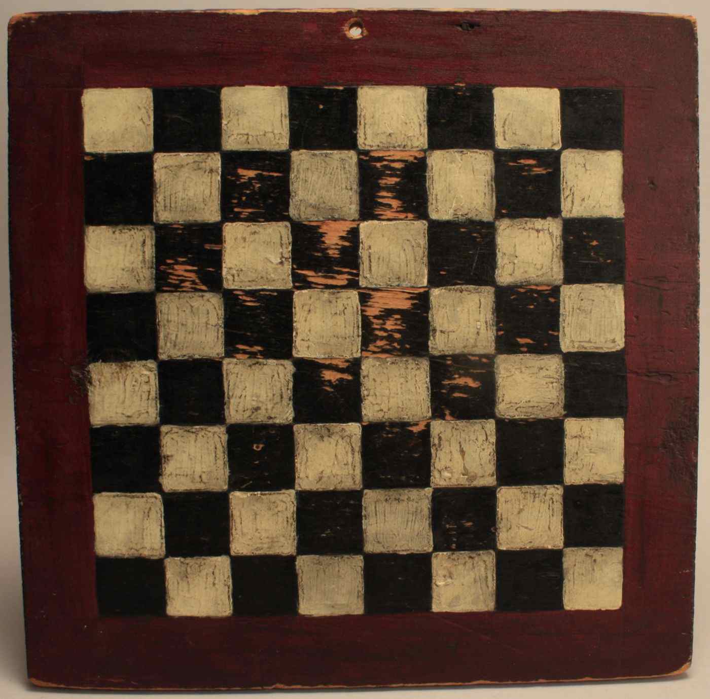 Appraisal: UNFRAMED RED-PAINTED CHECKERBOARDDated With black and white checker squares Painted