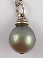 Appraisal: A grey cultured pearl pendant on a silver chain the