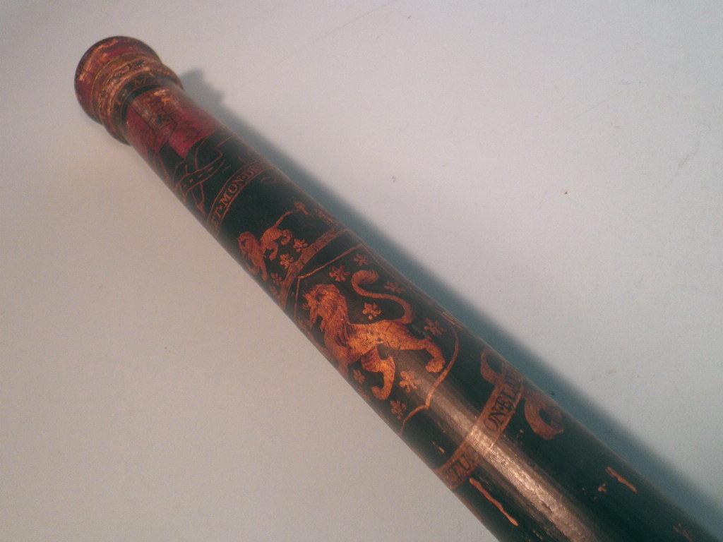 Appraisal: A thC ebonised wooden truncheon or tipstaff carved with a