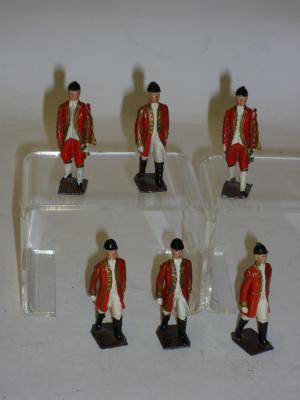 Appraisal: Four Britains metal coachmen and two similar unmarked figures carrying