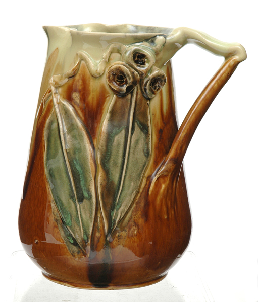 Appraisal: REMUED Victoria Circa Earthenware branch handled jug with applied gum