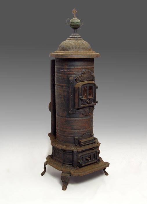 Appraisal: CAST IRON ORNATE ARBUTUS WOOD STOVE Makers name ARBUTUS above