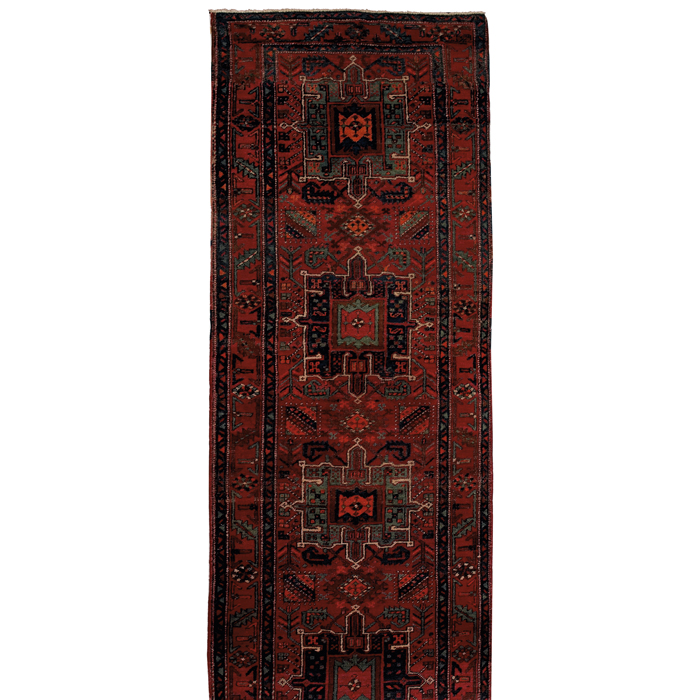 Appraisal: Persian Heriz runner c stylized floral design with medallions on