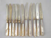 Appraisal: A set of six individual butter knives with silver sabre