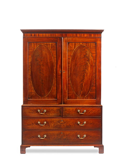 Appraisal: A GEORGE III MAHOGANY LINEN PRESS the twin panelled doors