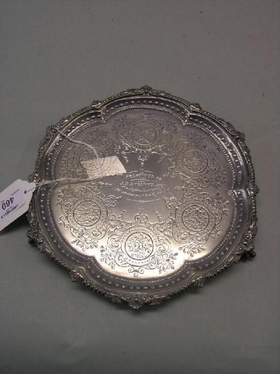 Appraisal: A Victorian engraved silver card tray with cast border on