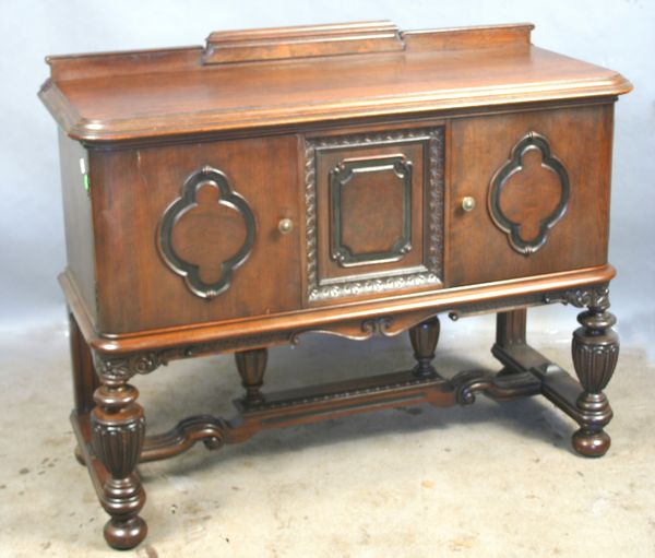 Appraisal: Circa s s mahogany sideboard with carved front panel and