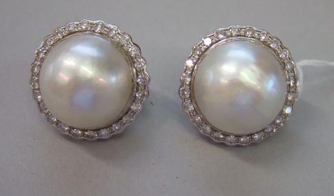 Appraisal: A pair of mabe pearl and diamond set earclips each