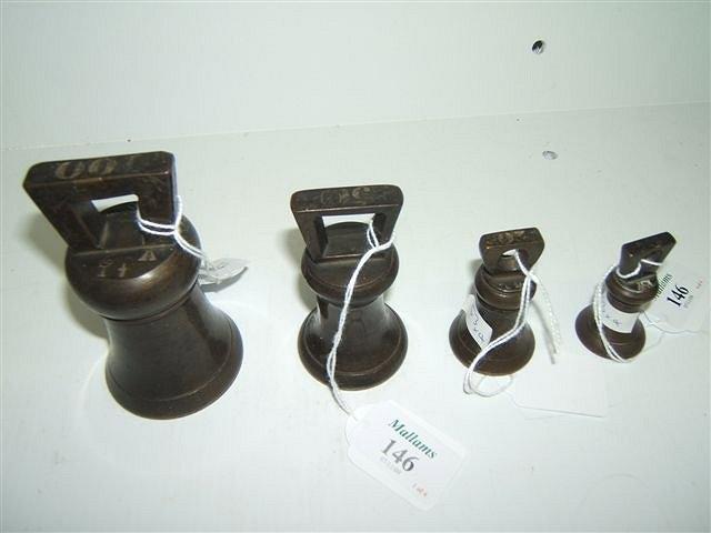 Appraisal: A GRADUATED GROUP OF FOUR ASSOCIATED BELL WEIGHTS with various