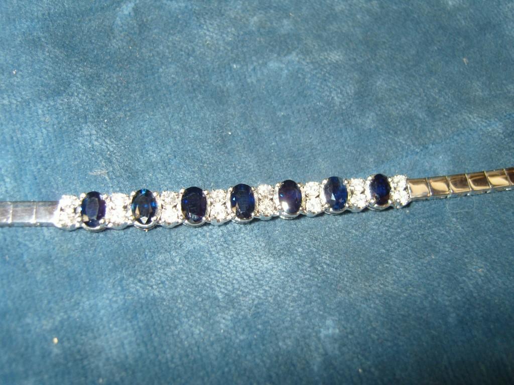 Appraisal: An k white gold necklace set with oval sapphires and