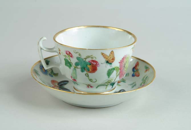 Appraisal: LARGE CHINESE EXPORT CUP AND SAUCER Decorated with flowers butterflies