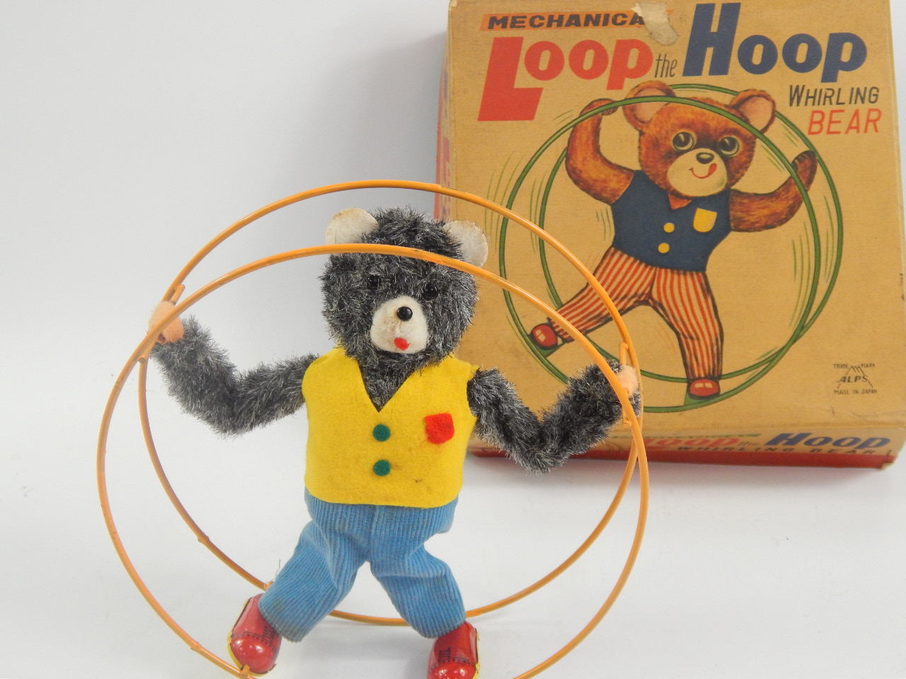 Appraisal: A Japanese mechanical loop the loop whirling bear made by