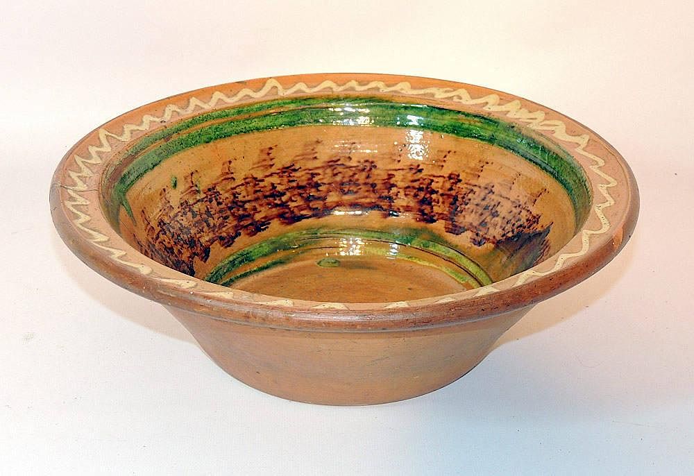 Appraisal: Delaware Valley Redware Mixing Bowl With manganese and slip decoration